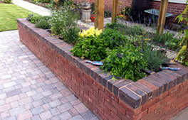 learn about our use of sleepers and raised beds for gardens